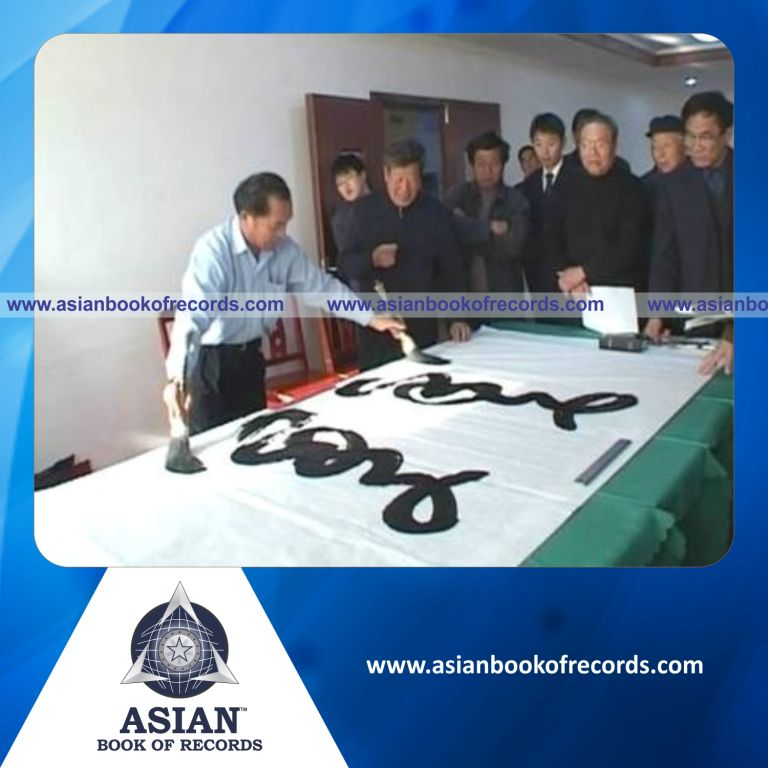Largest Calligraphy Written in Clockwise and Anti-Clockwise using both the Hands Simultaneously by an Individual (Male)