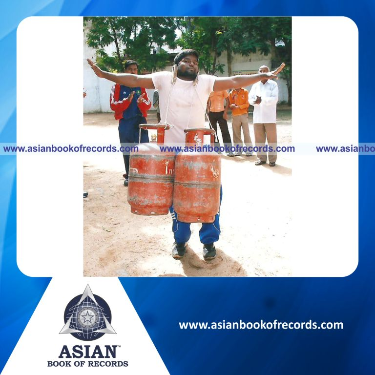 Gas Cylinders Lifted with Ears by an Individual (Male)