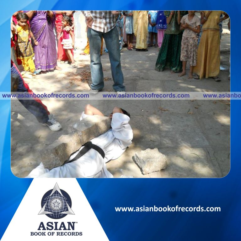 Heaviest Granite Stones Broken on his Chest with a 5 kilograms of Hammer by an Individual (Male)