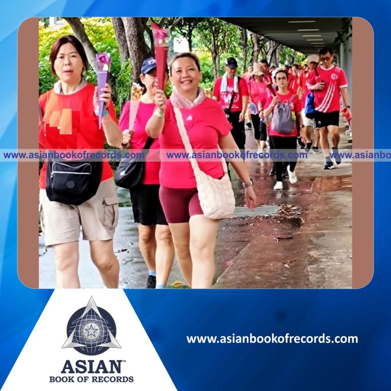 Highest Number of Participants Walking Simultaneously Holding Gold Foil Flowers