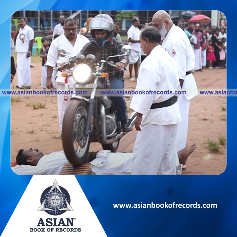 Highest Number of Bikes Rode Over a Human Stomach
