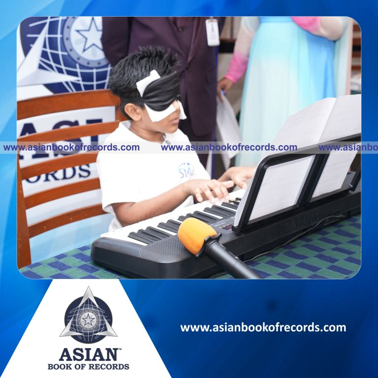 Highest Number of Distinct Songs Played Blindfolded on Piano in 10 Minutes by an Individual (Minor-Male)