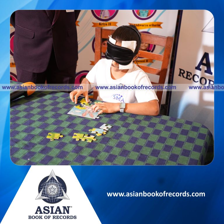 Fastest Time to Arrange a 16-Piece Picture Puzzle while Blindfolded by an Individual (Minor - Female)