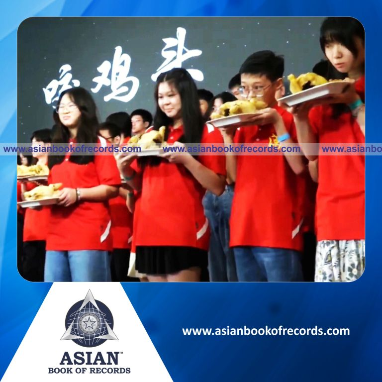 Highest Number of Participants Biting Chicken Heads Together